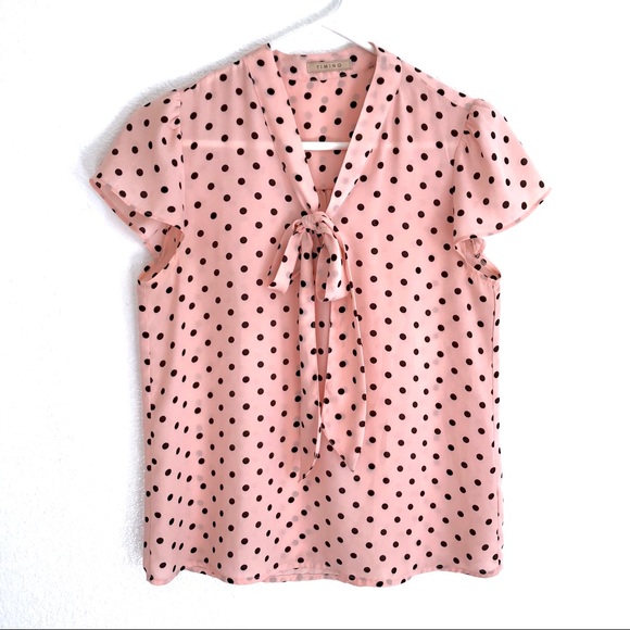 pink and black polka dot blouse